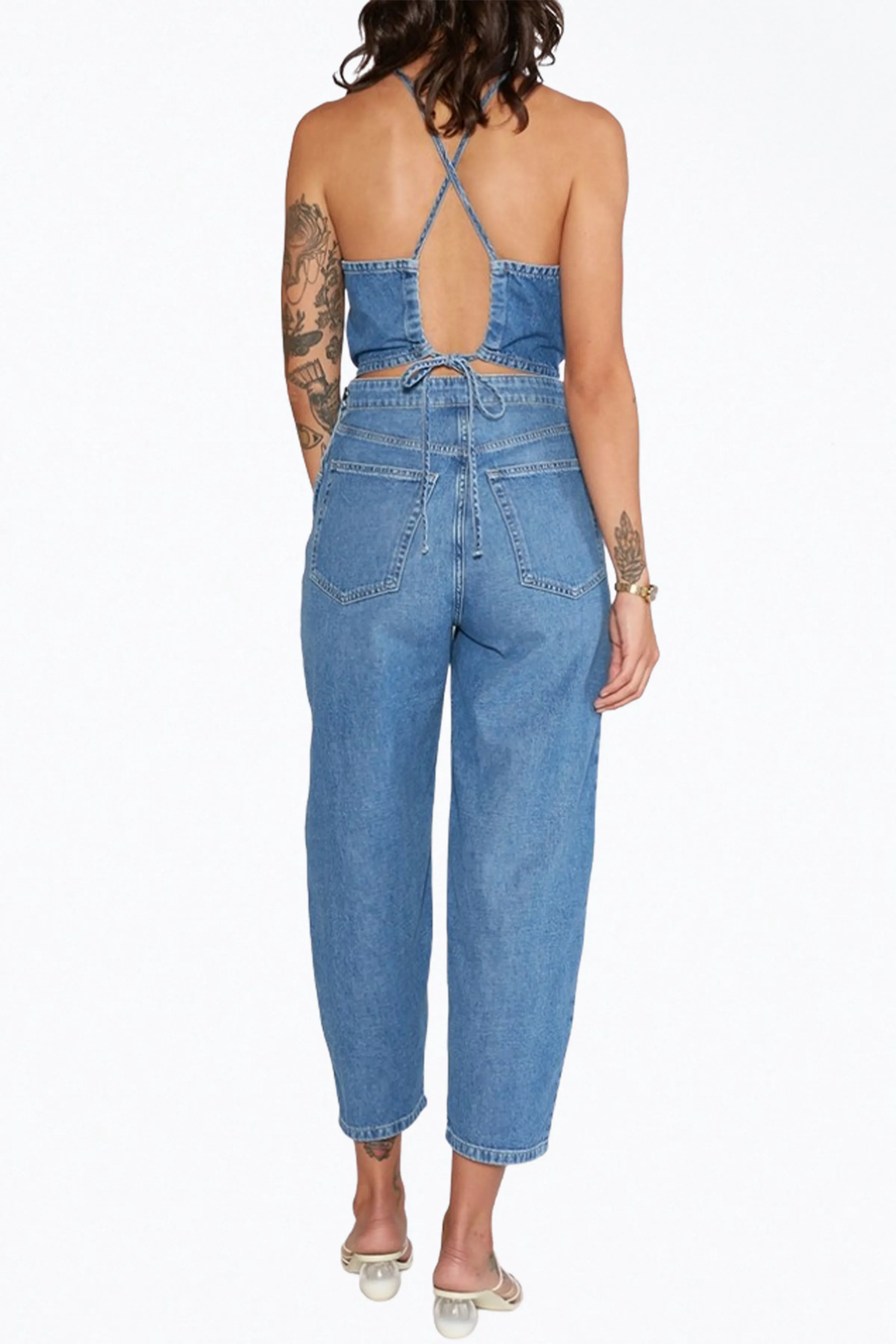 BIRDIE HALTERNECK WRAP-EFFECT OPEN-BACK CHAMBRAY JUMPSUIT